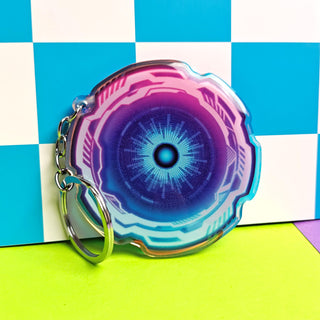 Keychain with a futuristic design on a checkered background