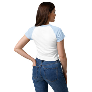 Woman wearing a white t-shirt with blue sleeves and blue jeans on a white background.