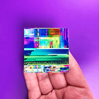 Colorful abstract pattern on a small square card held against a purple background