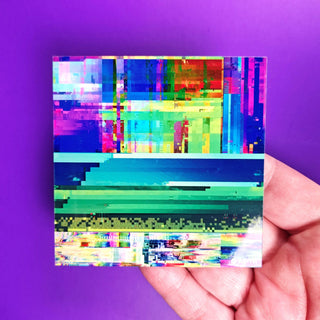 Colorful abstract pixel art held against a purple background