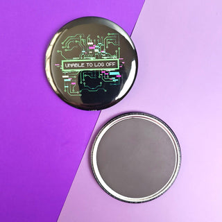 Circular metallic object with electronic design on a purple background