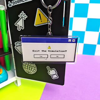 Keychain with 'Exit the Simulation?' design on a colorful background