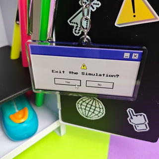 Keychain with 'Exit the Simulation?' dialog box design on a colorful background