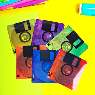 Colorful floppy disks on a yellow background
