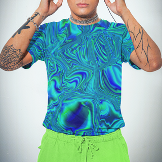 Person wearing a blue and green patterned shirt and green pants, with tattoos visible on arms.