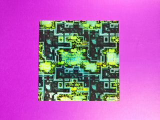 Geometric pattern with green and black shapes on a purple background