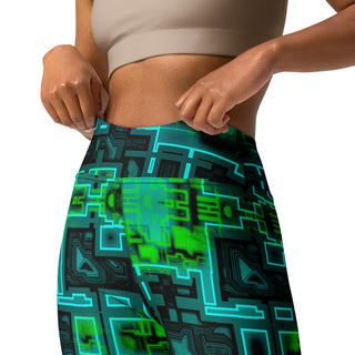 Person wearing a pair of leggings with a green and black geometric pattern on a white background