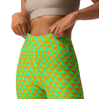 Person wearing a colorful geometric-patterned leggings on a white background