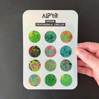 Green Psychedelic Circles Holographic Sticker Sheet by AIPYR held by a human hand over a black background.