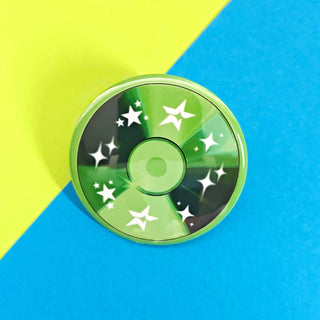Green cd button with star patterns on a blue and yellow background