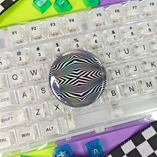 Clear keyboard with colorful keys on a checkered background