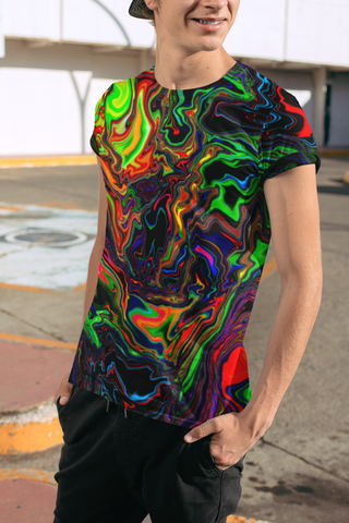 Person wearing a colorful, abstract-patterned t-shirt outdoors.