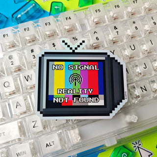 Pixelated screen with 'No Signal Reality Not Found' text on a keyboard background