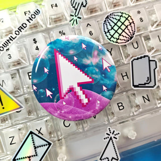 Pixelated computer mouse cursor button on a keyboard with decorative keycaps