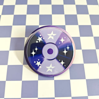 Round purple cd button with star patterns on a checkered background