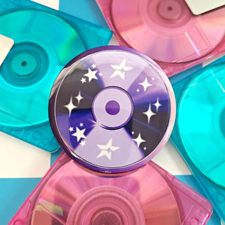 Colorful CD cases with star designs on a checkered background