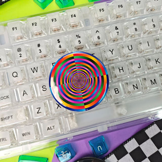 Colorful keyboard with a transparent top cover featuring a rainbow spiral design.