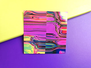 Colorful abstract patterned paper on a yellow and purple background