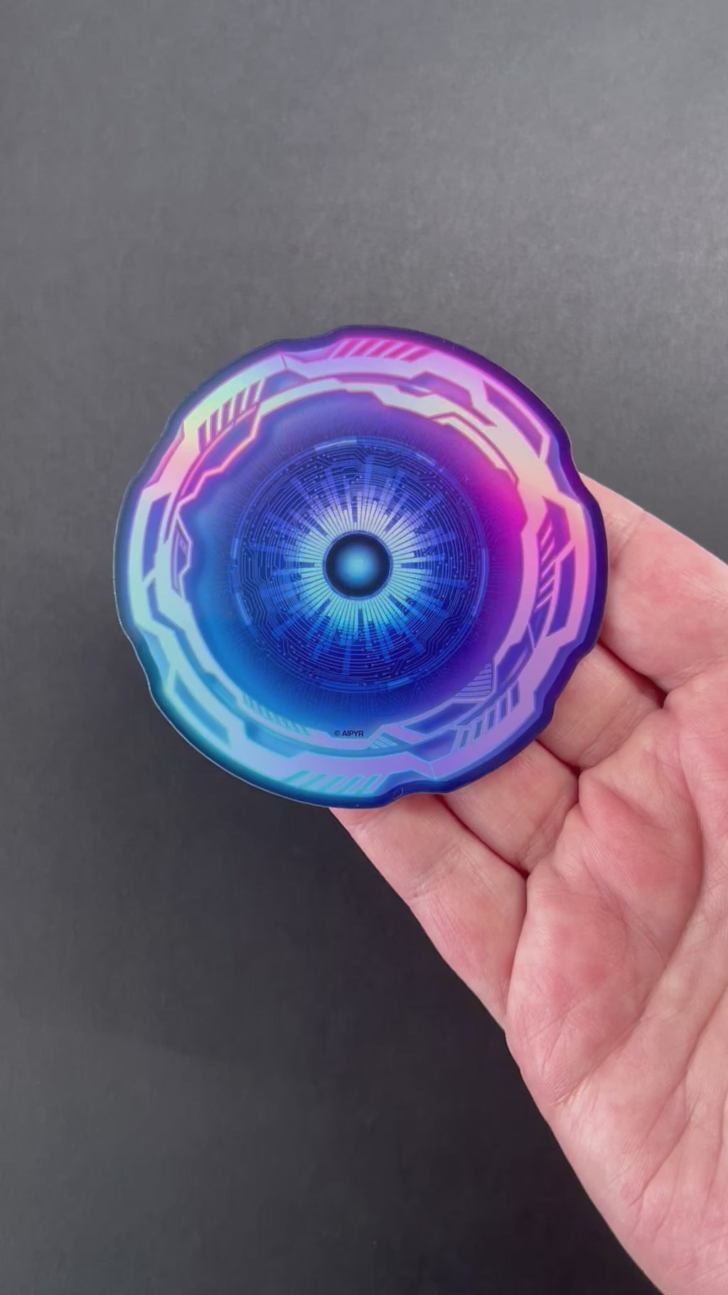 Video of the Cyber Eye Holographic Sticker by AIPYR over a black background.