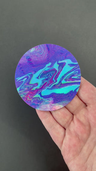 Video of the Vaporwave Glitch Holographic Sticker by AIPYR over a black background.