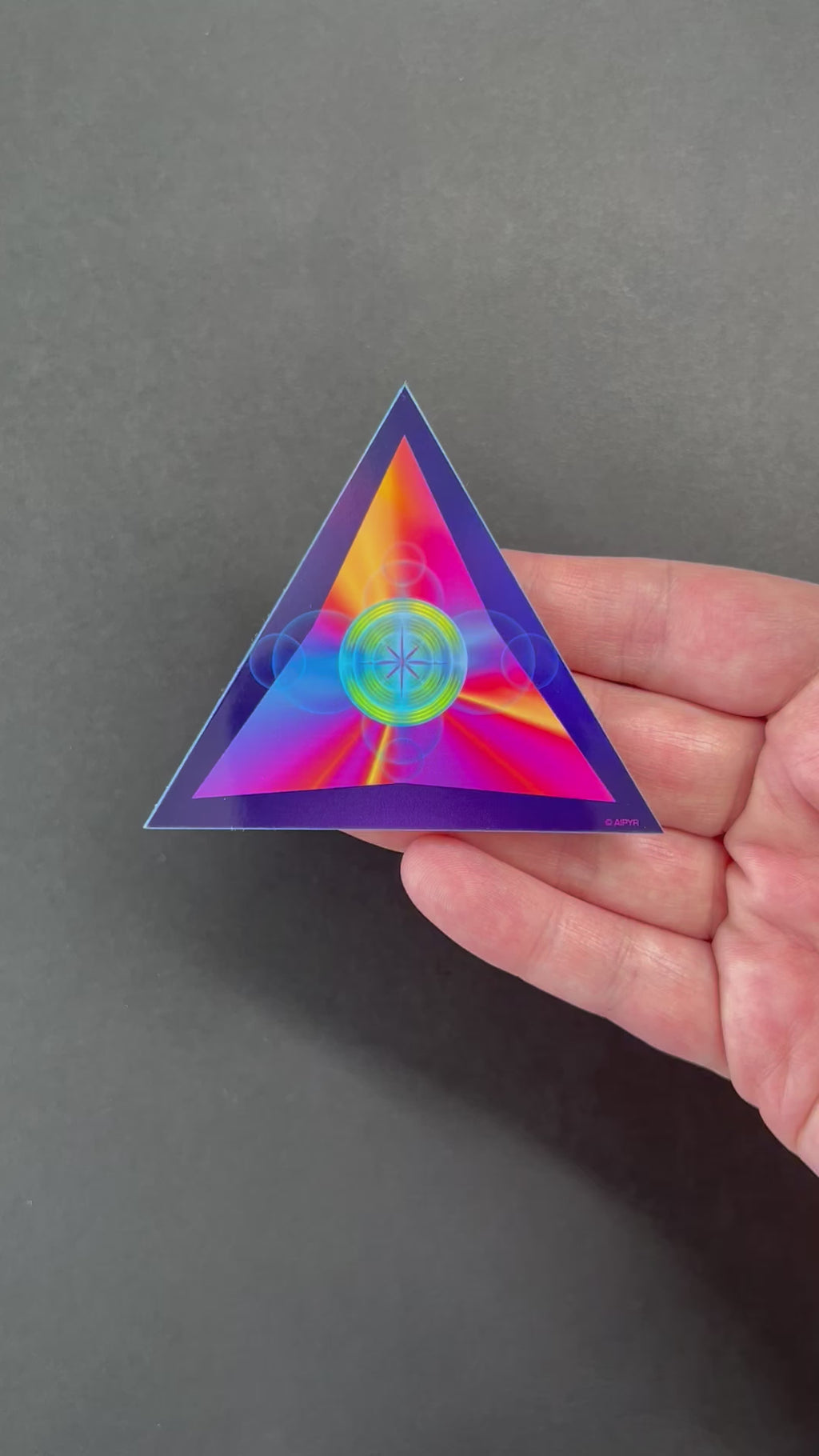 Video of the Ethereal Triangle Holographic Sticker by AIPYR. 