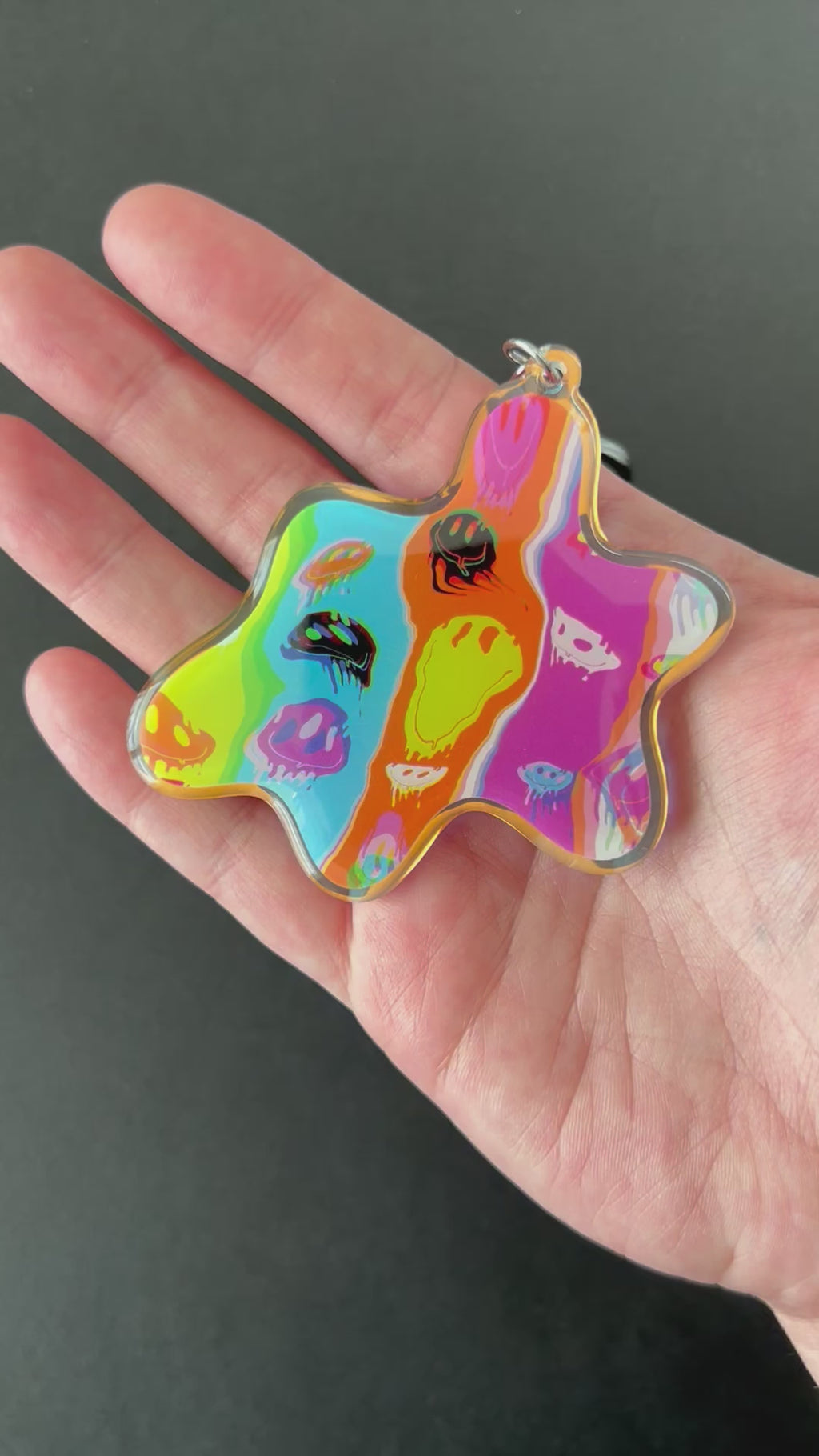 Video of the Acid Meltdown Blob Keychain by AIPYR over a black background.