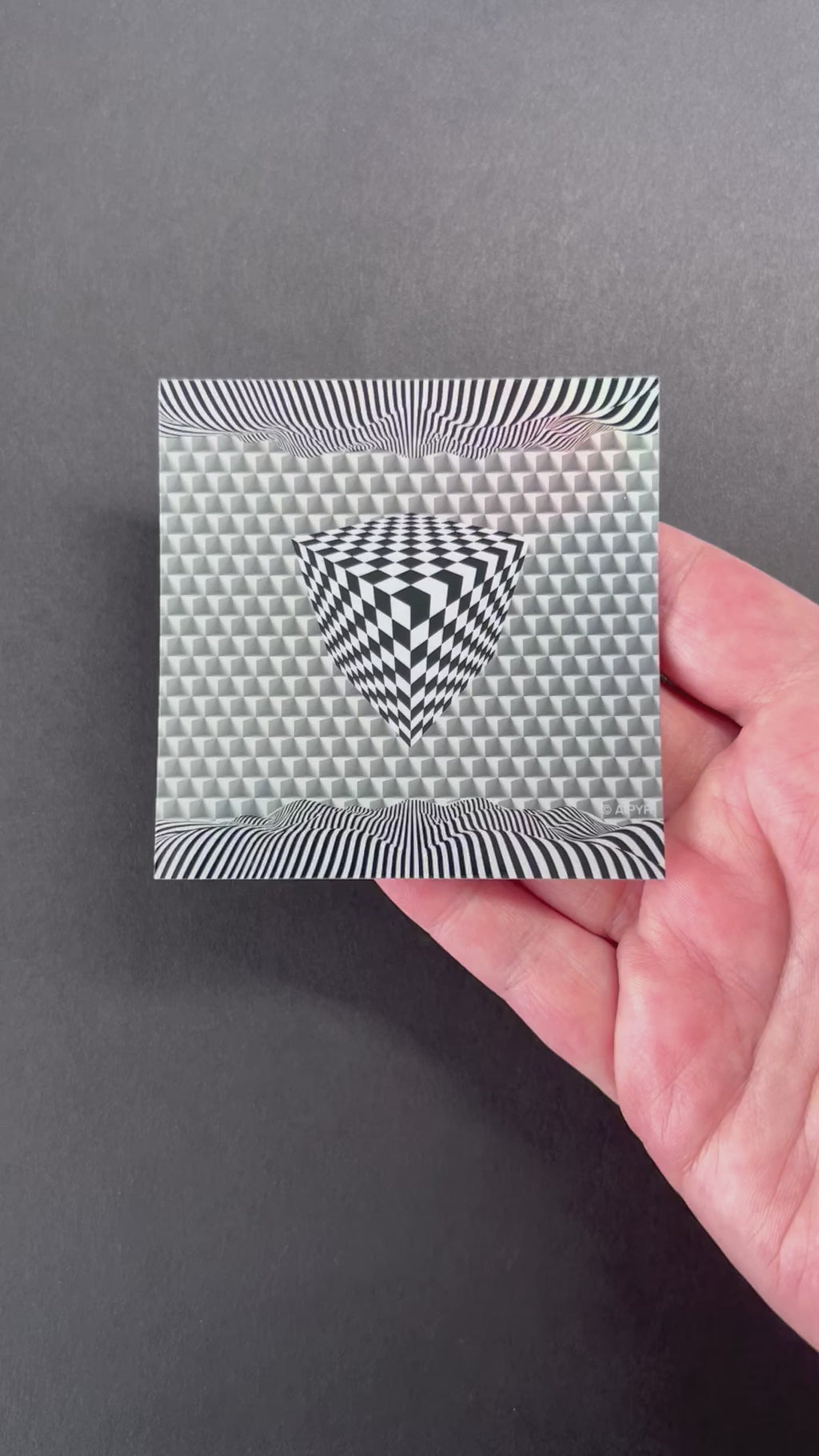 Video of the Cube Illusion Holographic Sticker by AIPYR over a black background.