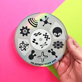 Y2K Aesthetic Sticker Sheet held by a hand against a colorful background